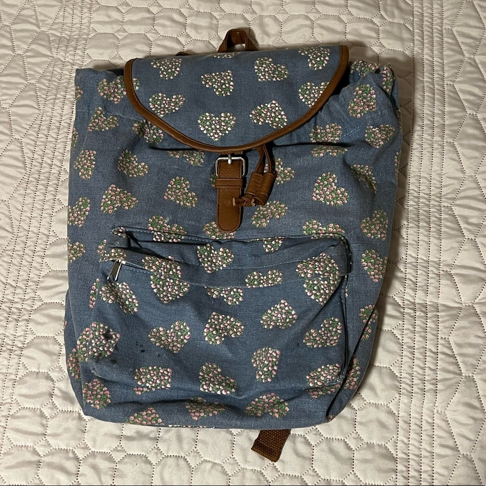 Blue back pack with flower hearts